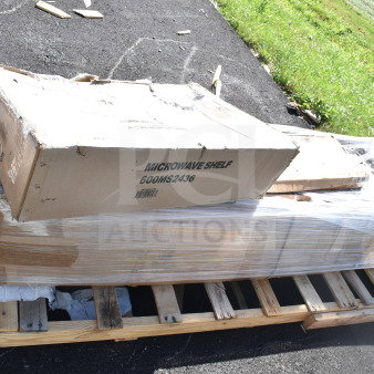 Boxes of brand new Ballymore ladder, Regency shelves, and Metro shelf on a pallet, partially shrink-wrapped.