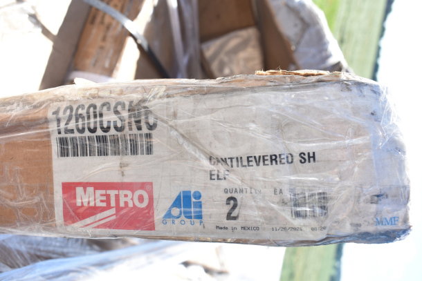 Packaging for Metro 1260CSNC Chrome Cantilever Shelf, labeled "Made in Mexico." Quantity: 2. Items new but with dents.