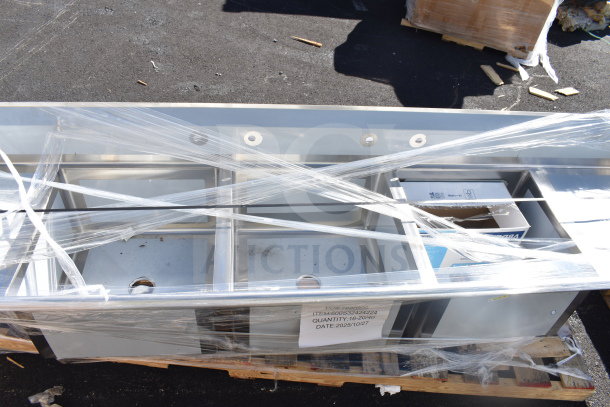 BRAND NEW SCRATCH AND DENT Regency 600S32424224 3 Bay Sink with Dual Drain Boards, wrapped in plastic on wooden pallet.