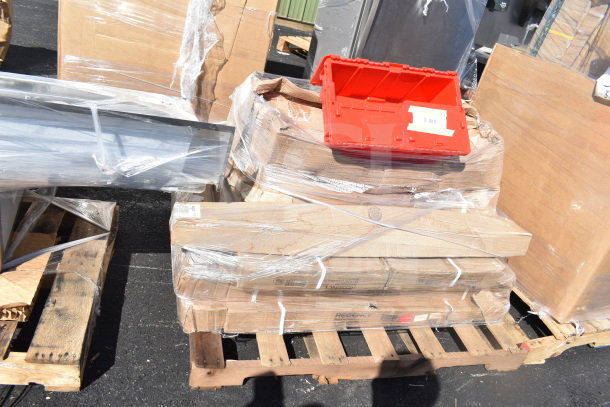 Auction lot with 9 new scratch-and-dent items, including shelves, a floor mat, and a work table. Wrapped on pallets.