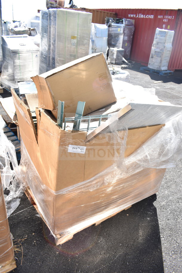 Pallet of 12 new scratch and dent items, including heating element and stacking kit, wrapped in plastic. Tags indicate "217, Qty 12."