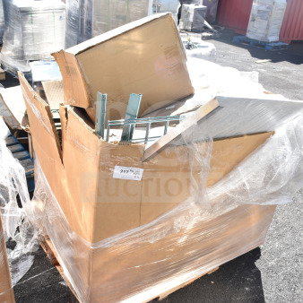 Pallet of 12 new scratch and dent items, including heating element and stacking kit, wrapped in plastic. Tags indicate "217, Qty 12."