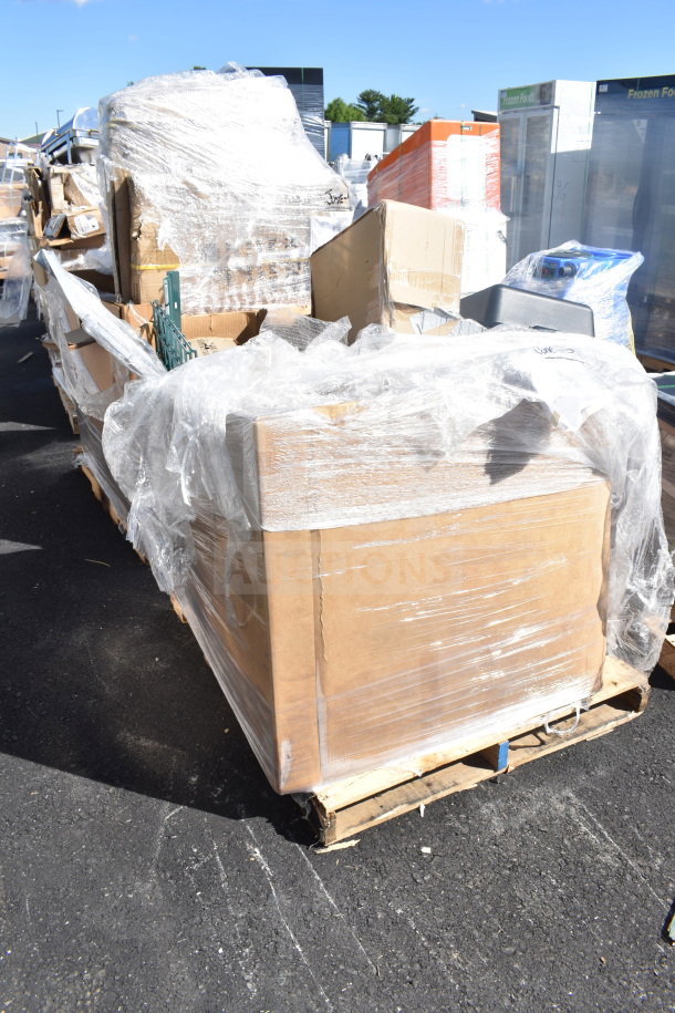 Bundle of 12 new scratch and dent items, including heating element and stacking kit, wrapped on pallet for auction.