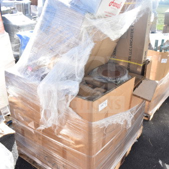 Pallet with 8 brand new scratch and dent items wrapped in plastic, including ticket holders and shelves. Boxes labeled "Fanale."