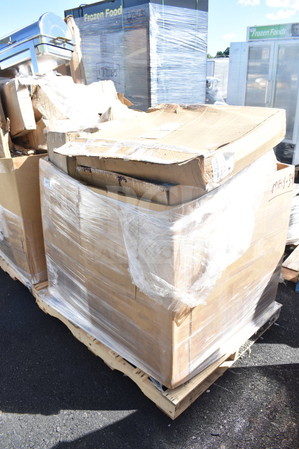 Pallet with 8 new scratch and dent items, including a sink and evaporator coil, wrapped in plastic. Boxes show wear. Marked "MAY-34".