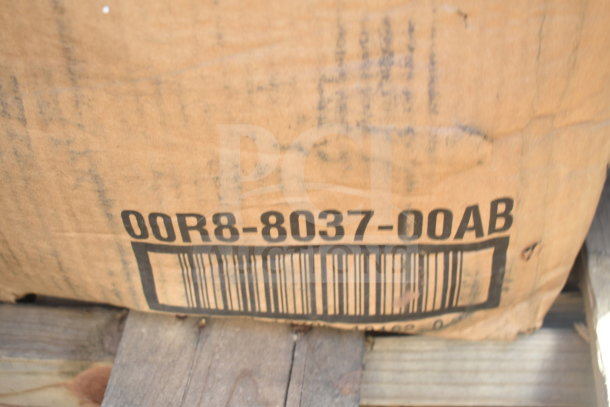 Cardboard box labeled "00R8-8037-00AB" with barcode, indicating part of auction lot JUN26-35, including ingredient bins and red chairs.