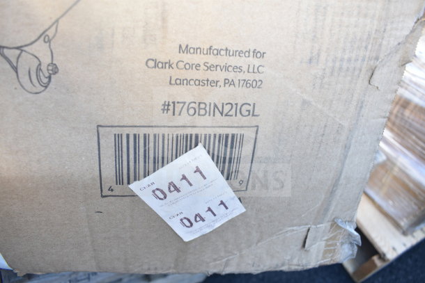 Cardboard box with a barcode and a manufacturing label for Clark Core Services, LLC, model #176BIN21GL, slightly damaged.