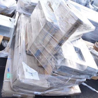 Plastic-wrapped pallet of 12 new scratch and dent items, including shelf kit and cake stand. Boxes labeled with codes JUN26-34, JUN26-55.