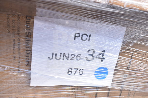 Plastic-wrapped boxes showing a label with "PCI JUN26-34" and a blue sticker. Contains 12 mixed scratch and dent items.