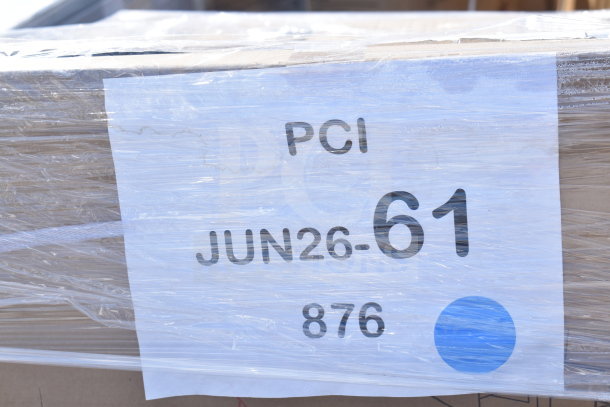Auction item pallet with 12 new scratch and dent items. Label reads "PCI JUN26-61 876" with plastic wrapping.