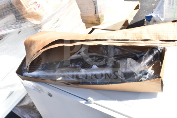 Sensormatic ZPUODPP-ENC enclosure in box, wrapped in plastic, appears new, part of a two-item auction lot.