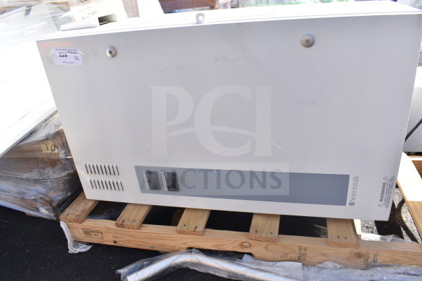 Sensormatic ZPUODPP-ENC enclosure on wooden pallet; in good condition, with system controls and warning label visible.