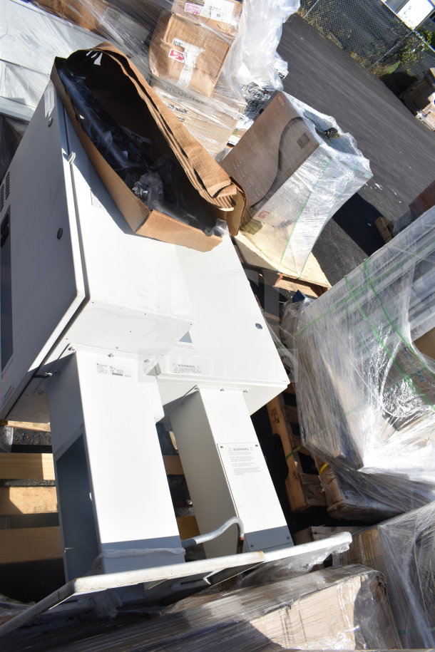 Sensormatic ZPUODPP-ENC enclosure on a pallet, showing metal structure and original packaging. Some wear visible.