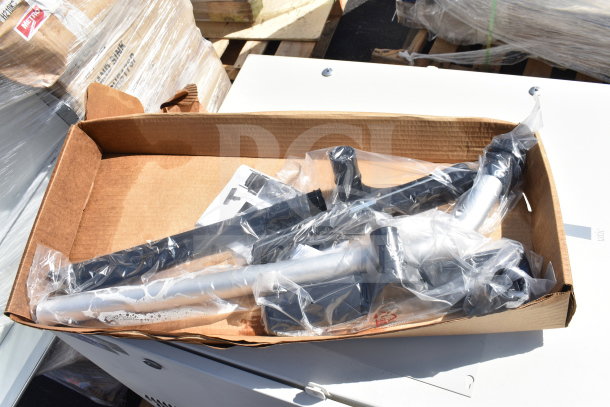 Two Sensormatic ZPUODPP-ENC enclosures in original packaging, in good condition. Cardboard box on a pallet.