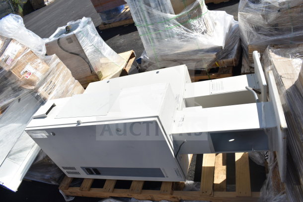 Sensormatic ZPUODPP-ENC enclosure, white, mounted on pallet. Encased in plastic wrap. Good condition. Two included.