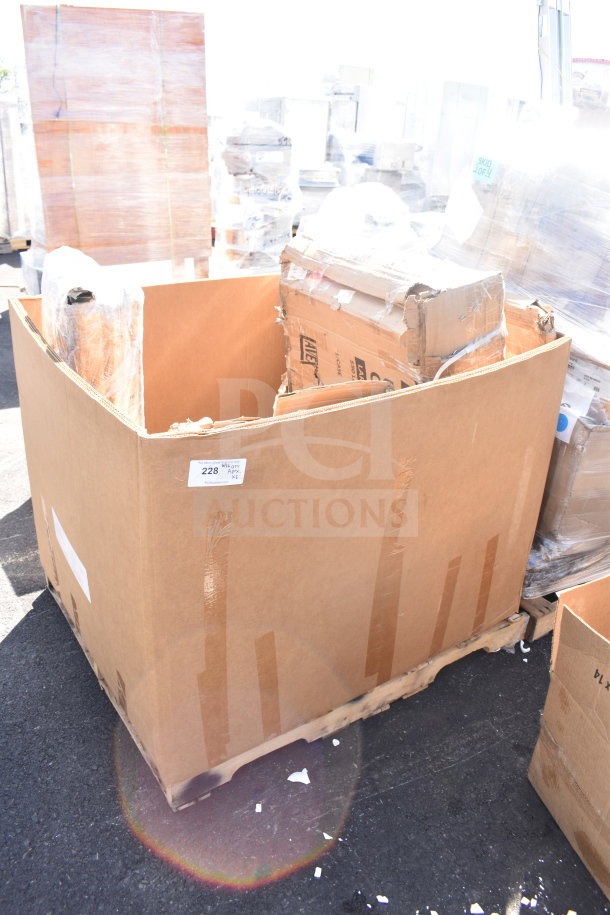 Cardboard box containing 8 new scratch and dent items, including a smoker pole and utility cart, on a pallet. Label indicates "228 APEX x1".
