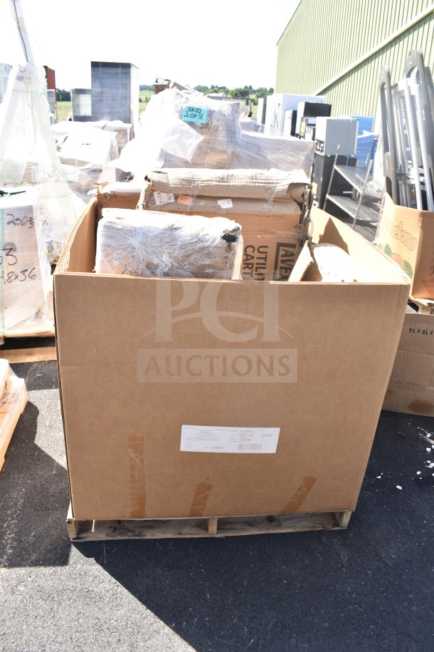 Cardboard box containing new scratch and dent items including a smoker pole and utility cart, on a pallet. Visible tags and labels.