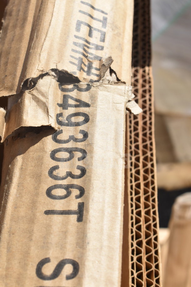 Cardboard box with item number 3493636T visible, showing signs of damage. Contains new "scratch and dent" items.
