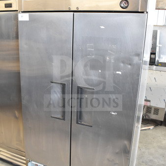 2017 True T-35 commercial 2-door reach-in cooler, stainless steel, 115V, 1 phase, visible scuffs, True branding on top.