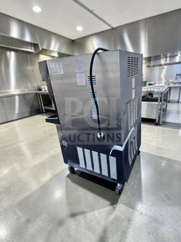 Taylor 349-33 slush machine, 4-flavor, 208-230V, 3-phase, in exceptional condition. UL/NSF listed, fully tested, operational.