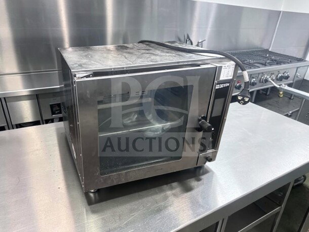 Doyon DCOT5 electric countertop convection oven, half size, 208V, single phase, ETL/NSF certified, excellent condition.