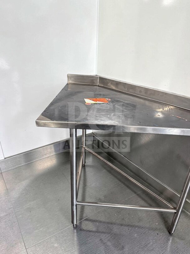 Wasserstrom 48" stainless steel work table, pristine condition, 3-sided backsplash, NSF certified, model WAS-S-PREP-1101.