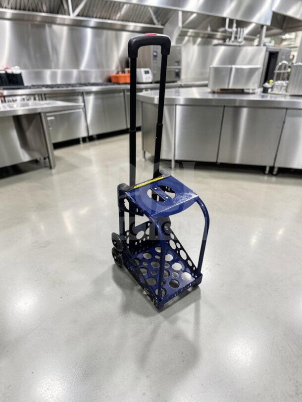 ZUCA Sport Frame rolling cart in navy blue with built-in seat, flashing wheels, and telescopic handle. Excellent condition.