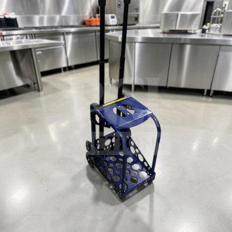 ZUCA Sport Frame rolling cart in navy blue with built-in seat, flashing wheels, and telescopic handle. Excellent condition.