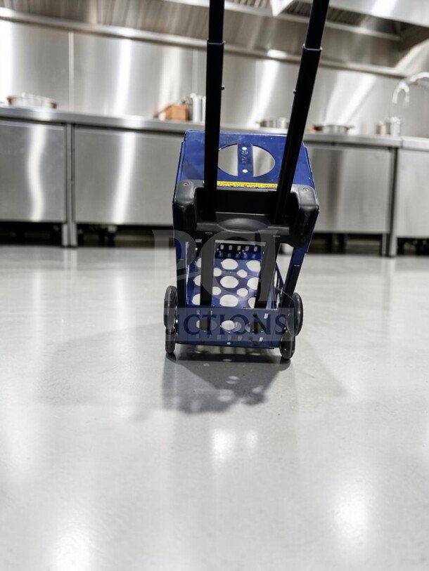 ZUCA Sport Frame rolling cart in navy blue, excellent condition, features built-in seat, flashing wheels, fully inspected.