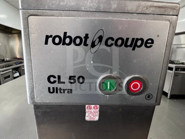 Robot Coupe CL50E Ultra commercial food processor, immaculate condition, ETL listed, with 2 discs. Buttons for operation visible.