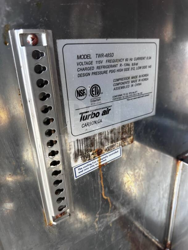 Turbo Air TWR-48SD-N label showing 115V, 60Hz, NSF/ETL certified, made in Korea, R-134a refrigerant details.