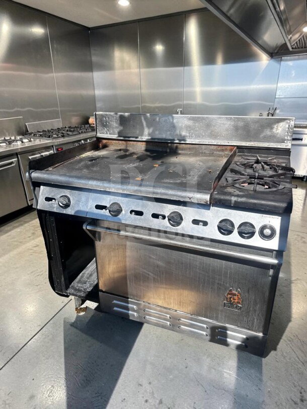 Wolf C48S-2B36G gas restaurant range, 48" wide, 2 burners, 36" griddle, oven, and cabinet base, 155,000 BTU, excellent condition.