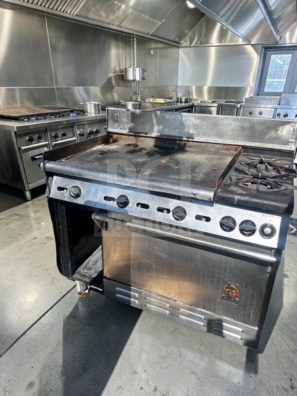 Wolf C48S-2B36G 48" gas range in superior condition, features 2 burners, 36" griddle, oven, and cabinet base, 155,000 BTU.