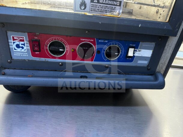 Metro C539-CDC-U-GY holding cabinet controls panel with temperature and moisture dials, on/off switch, and proofing settings.