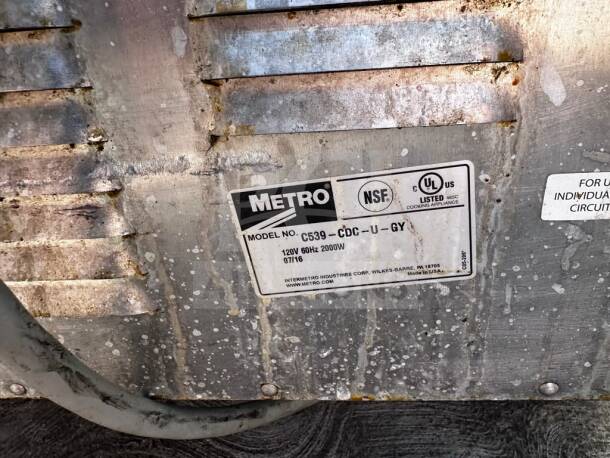 Metro C539-CDC-U-GY heated cabinet label, 120V, 2000W, UL and NSF listed, model details clearly visible, fully operational.