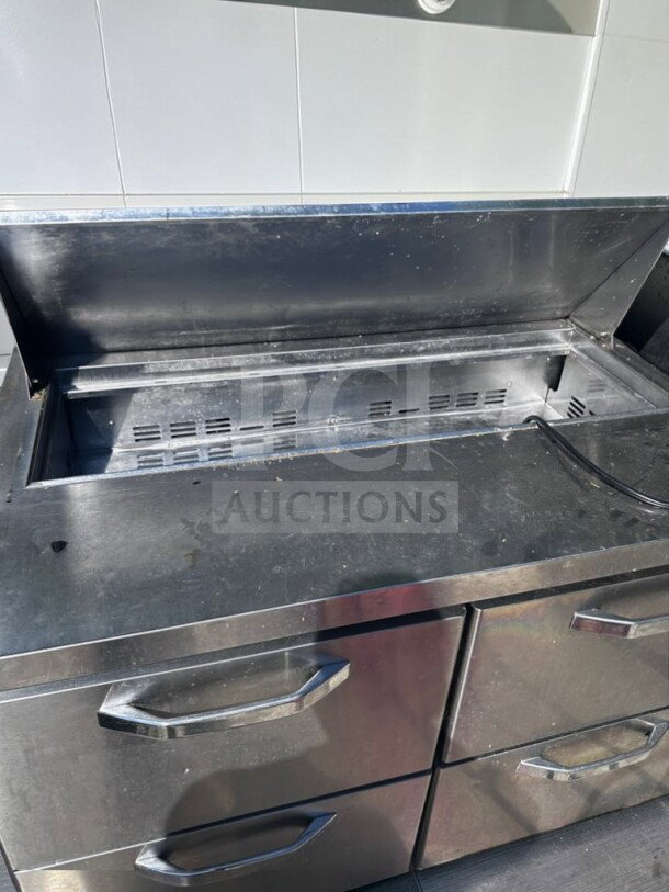 Blue Air BLPT48-D4-HC prep table, 48", two-section, 4 drawers, 12-pan capacity, 13.1 cu ft, stainless steel, good condition.