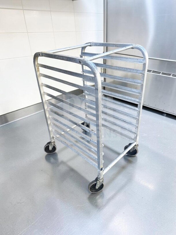 Channel aluminum bakery rack, full-height, 20-pan capacity, NSF certified, mobile, in excellent condition.