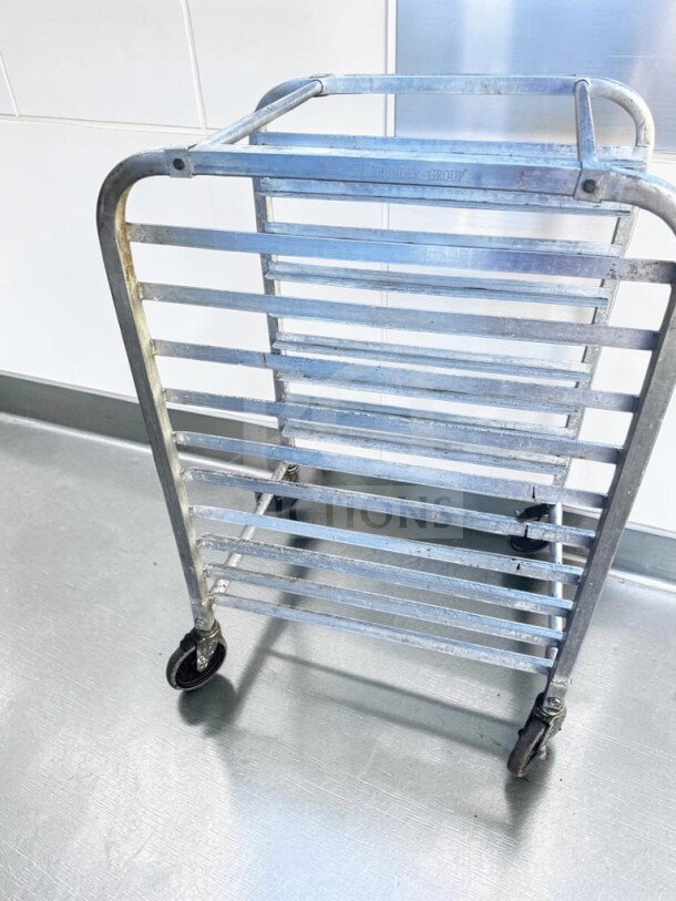 Channel aluminum mobile full-height bakery rack, 20 pan capacity, NSF certified, good condition, fully inspected, on wheels.