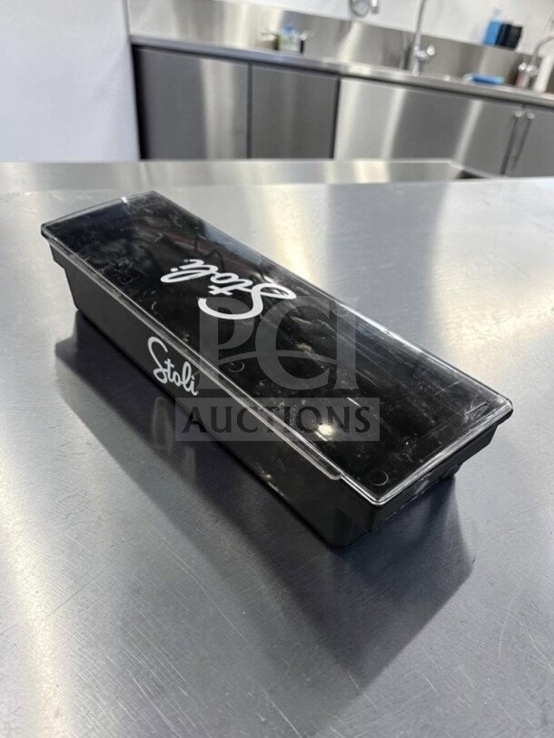 Stoli 6-compartment bar condiment caddy in excellent condition, black plastic with clear lid, model STO-S-CAD-1129.