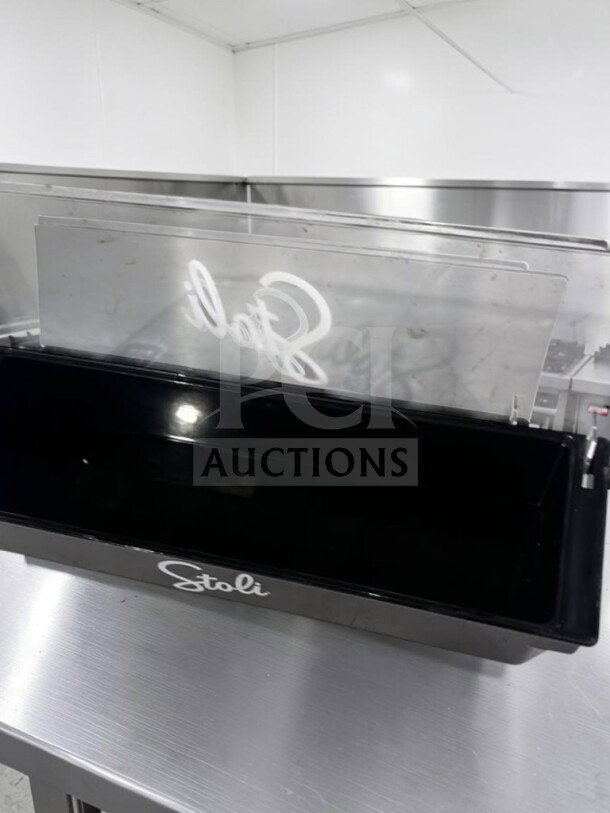 Stoli black plastic bar condiment caddy with clear lid, six compartments, excellent condition, model STO-S-CAD-1129.