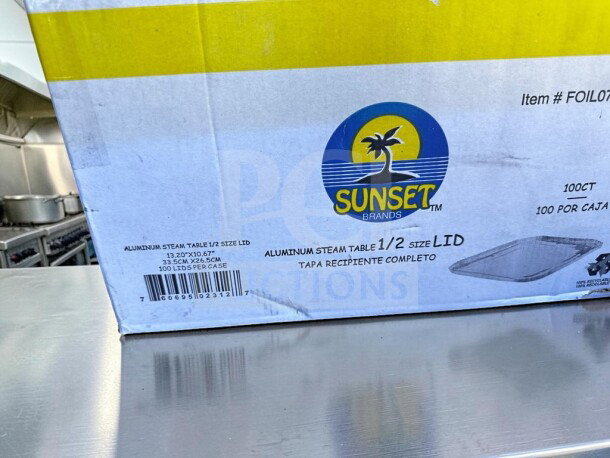 Box of 100 Sunset Brands FOIL07 aluminum steam table 1/2 size lids, brand new, with labels indicating dimensions and count.