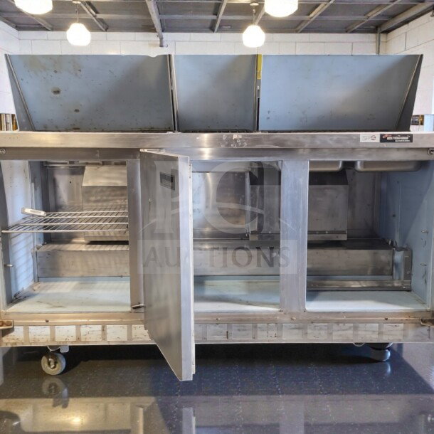 Prime condition stainless steel refrigerated sandwich prep table, 3-door, fully operational, by Commercial Foodservice Equipment.