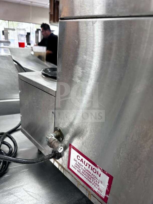 Wilbur Curtis ALPHA-IIIS commercial coffee brewer, stainless steel, 3 warmers, tested, operational, visible caution label.