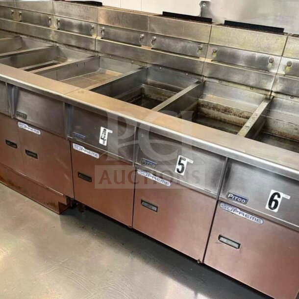 Pitco SSH55 commercial gas fryer battery with 5 units, 50 lb vats each, natural gas, built-in filtration, excellent condition.