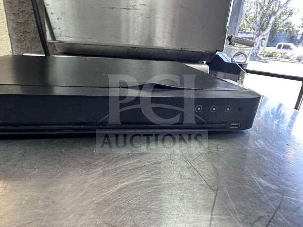 Hikvision DS-7216HQI-K2 DVR, 16-channel TurboHD, elite condition, fully tested, sleek black design, operational unit.