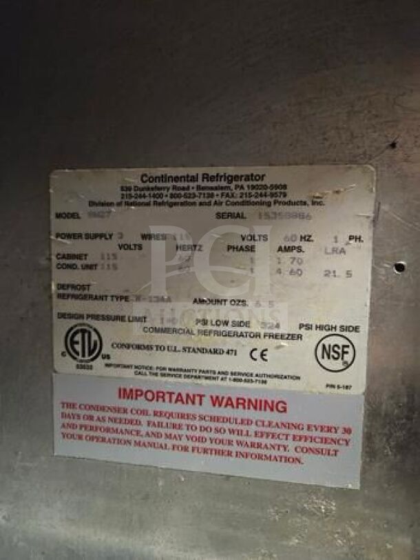 Stainless steel Continental undercounter refrigerator label showing model, voltage, refrigerant type, and maintenance warning.