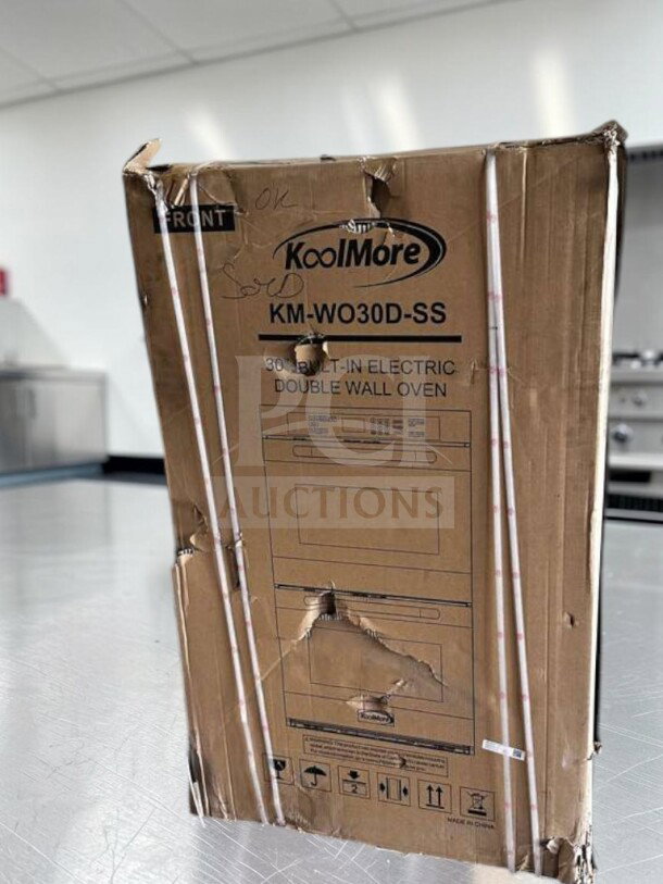 KoolMore KM-WO30D-SS 30” double wall oven in box, digital controls, stainless steel, new condition, model label visible.