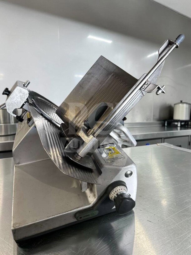 German Knife GS-12M 12" Heavy Duty Manual Slicer, 1/2 HP, excellent condition, fully tested, visible safety markings.