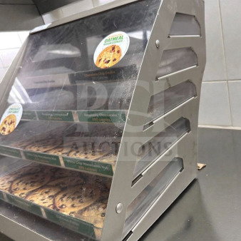 Commercial countertop multi-tier bakery display case with cookies, stainless steel frame, clear panels, excellent condition.