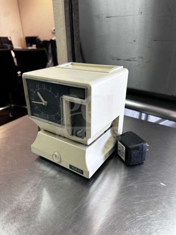 AMANO TCX-11 time clock recorder, model 5477, in prime condition with adapter, fully tested and operational.